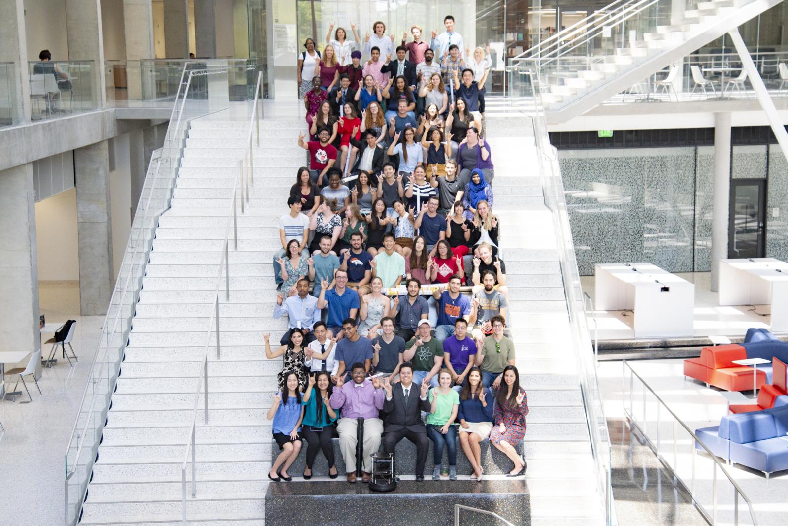 Past REU and RET participants pose in the ECE atrium. 