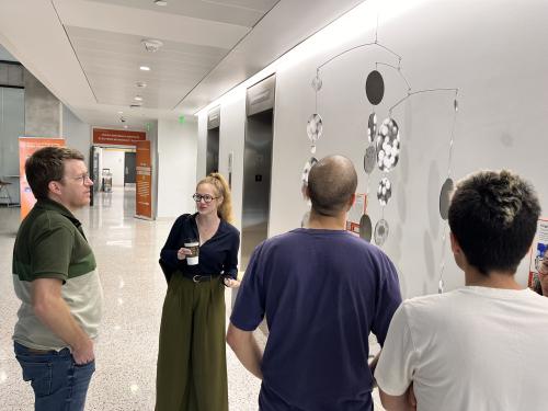 Guests discussing the piece with Virgina