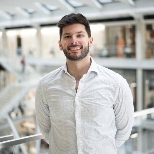 Headshot of Jacob wearing a white button down