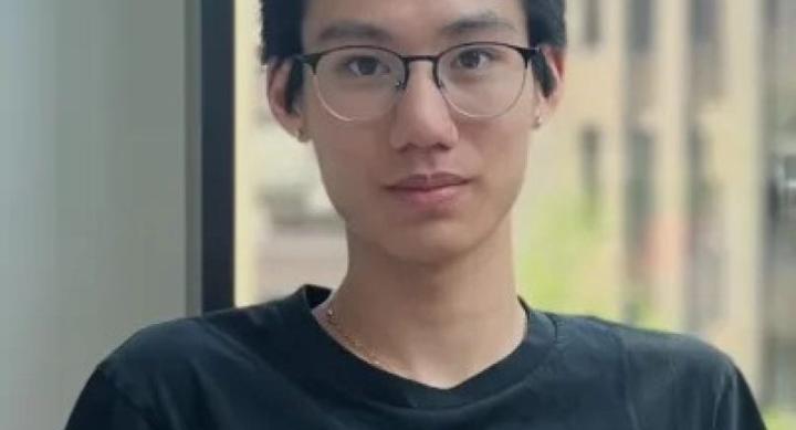 Headshot of Jadon Zheng; he has short black hair and glasses. 